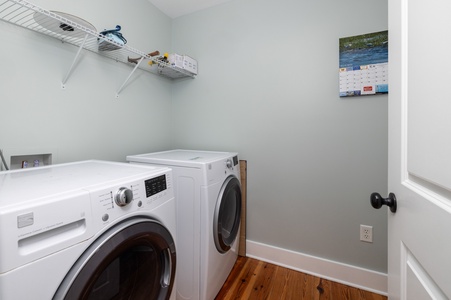 Your private laundry room keeps clothes fresh during your stay, complete with storage shelving for all your essentials.