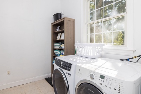 Your dedicated laundry space has organized storage for all your essentials.