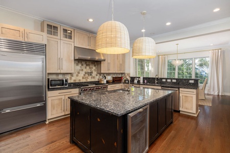 Your gourmet kitchen awaits with granite counters, stainless appliances, and a spacious island.