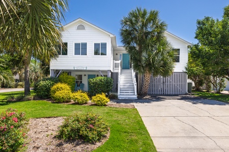 Welcome to Sandy Cheeks, a fully renovated 6-bedroom, 4-bathroom home on the elite Isle of Palms