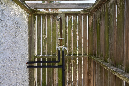 An outdoor shower is convenient after a day at the beach