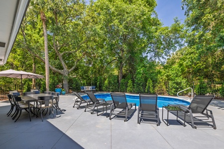 The sparkling private pool offers plenty of lounge chairs for large groups to enjoy