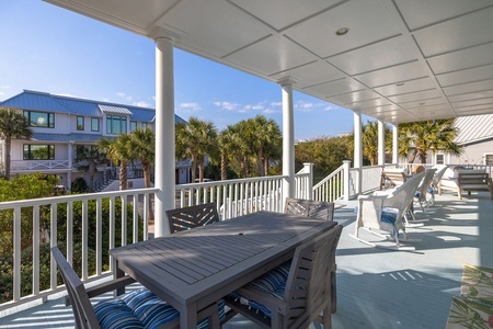 This oversized back porch is the perfect place to enjoy your morning coffee