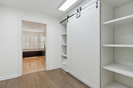 Pass through your walk-in closet to your primary en suite bathroom