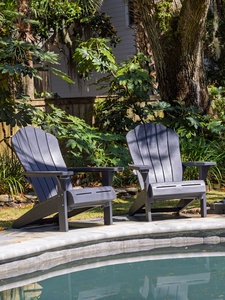 Sink into comfy Adirondack chairs by your private pool, surrounded by lush tropical gardens that create your perfect peaceful retreat.