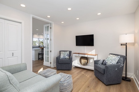 The sitting room can be a place for quiet conversation or the perfect spot for the kids to watch a movie.