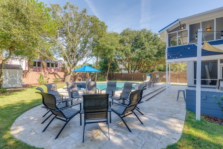 Your backyard features a stunning pool with plenty of outdoor seating
