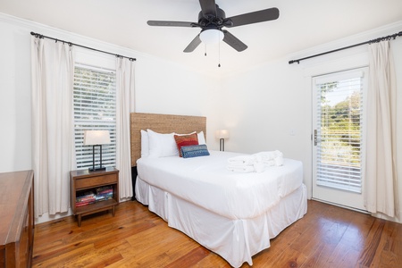 Sink into your queen bed with tall windows and private access to your deck