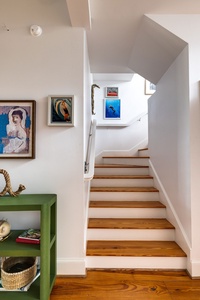 Take the beautiful wooden staircase to your second floor