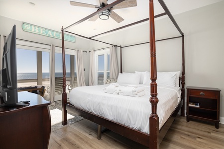 Rest after a long beach day in your king bed with stunning oceanfront views