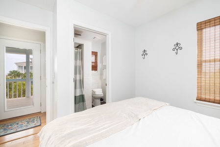An en suite bathroom and front porch access highlight your third story queen bedroom