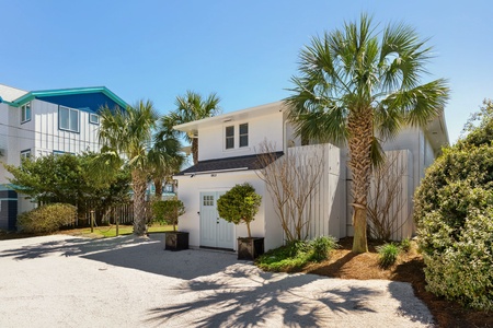 Sunshine By The Sea is surrounded by lush, tropical landscaping