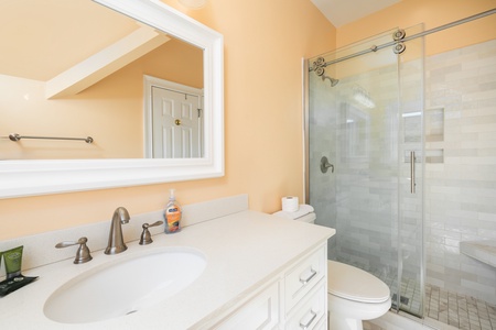 Your queen bedroom features an en suite bathroom with walk-in shower