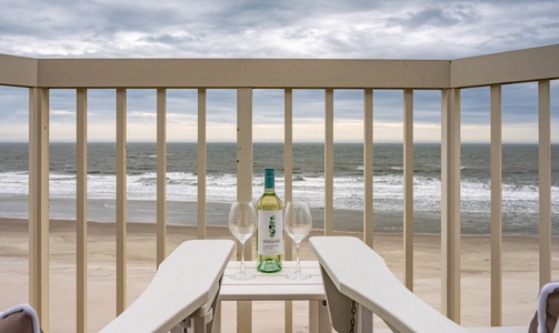 Sip wine on your private balcony while ocean waves create the perfect soundtrack for your beach getaway.