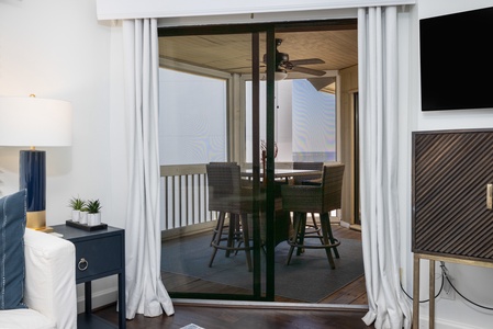 Step through glass doors onto your private screened in patio