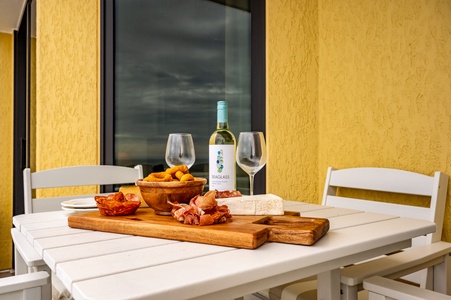 Savor wine and local delicacies on your private terrace, where golden walls create the perfect backdrop for memorable evenings.