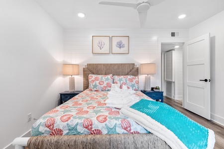 Your queen bedroom features shiplap panels and a wall-mounted TV