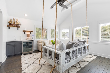 Your sitting room features a full wet bar and cozy rope swing