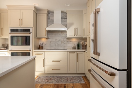 This elegant kitchen with modern appliances is ready for meal time