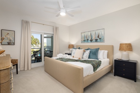 Sink into your coastal-themed bedroom with plush bedding, nautical touches, and a private balcony