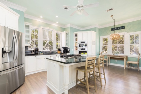 Your gourmet kitchen awaits with granite countertops, stainless appliances, and a welcoming island where you can prepare meals while chatting with loved ones.