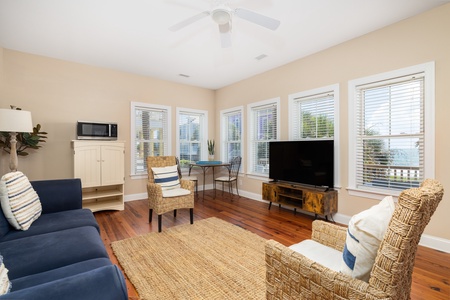 Take the steps to your main level where you'll find your cozy living room