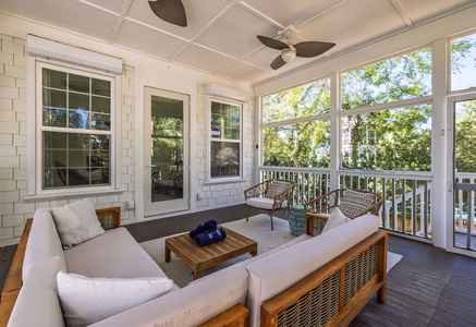 Unwind in your private screened-in back porch, where tropical breezes flow through floor-to-ceiling windows.