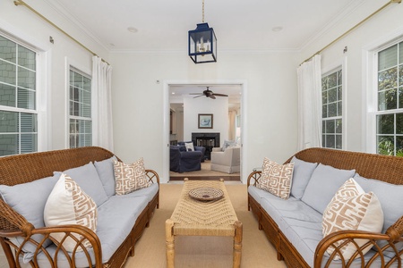 Relax in your sunroom where wicker chairs await your morning coffee.