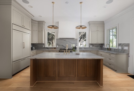 Your spacious gourmet kitchen awaits with marble countertops, premium appliances, and a stunning island perfect for cooking memorable meals together.