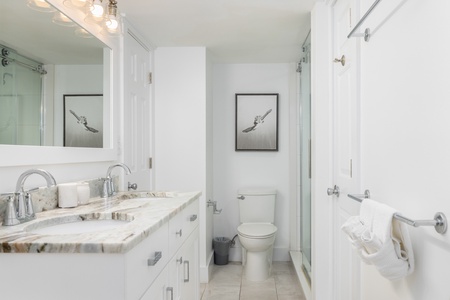 Freshen up in your queen en suite bathroom