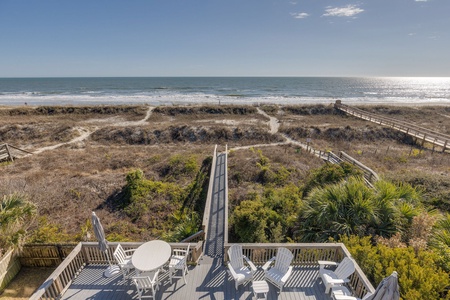 A short stroll down your private boardwalk and your toes will hit the sand
