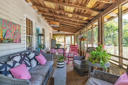 The front porch offers an abundance of seating options