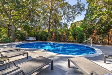 Private pool with lush landscaping