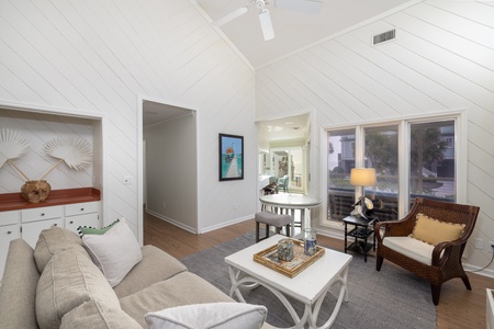Unwind in your bright coastal living room with vaulted ceilings, comfy seating, and charming beach-inspired décor that creates the perfect retreat.