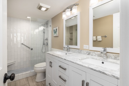 Dual vanities are ready for your morning routine in the second primary en suite