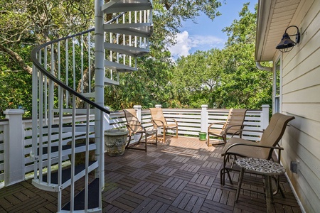 Second floor deck with stairs to rooftop deck