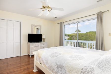 Your second floor queen bedroom has access to a private front deck