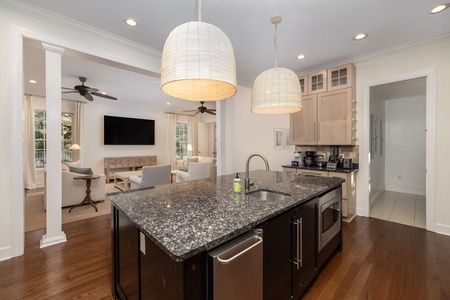 Your gourmet kitchen awaits with granite counters, stainless appliances, and a spacious island.