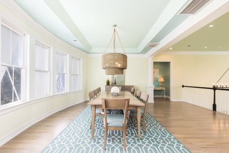 Dine under a stunning woven chandelier and near expansive windows for natural light