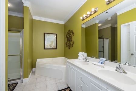 A jacuzzi tub and walk-in shower highlight your primary bathroom