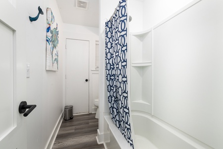 The bedrooms downstairs share a full bathroom with tub-shower combo