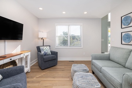 Sitting room with a TV provides space for everyone to spread out.