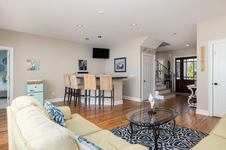 Your downstairs living space is complete with a bar