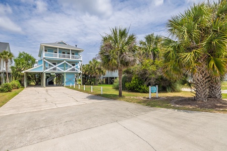 Pull into your tropical driveway with plenty of space for parking