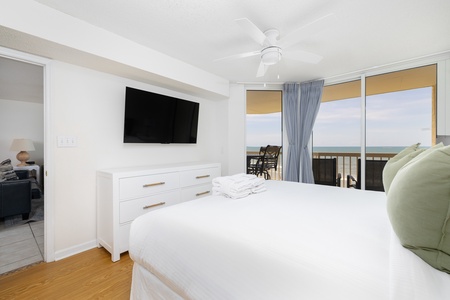 Wake up to sunrises over the water from your primary bedroom