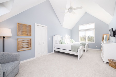 The twin bedroom has vaulted ceilings and plenty of natural light.