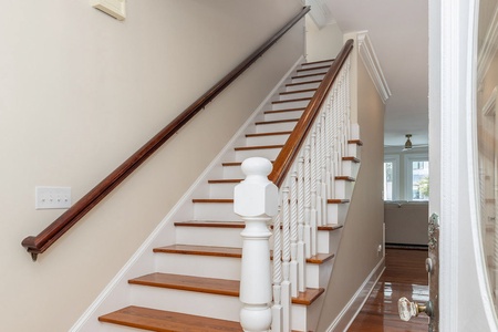 Your elegant wooden staircase takes you to the second floor