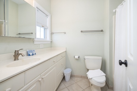 Your second king en suite bathroom features a walk in shower and large vanity