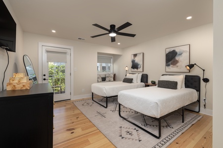 The twin bedroom is perfect for the kids and has private access to the deck
