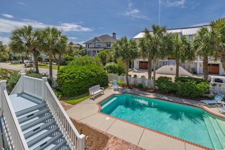 From your covered back porch, take the steps down to your crystal clear swimming pool